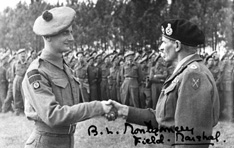 Copy of a photograph for Mrs MacPherson, 5 County Cottages, Trades Park, Nairn showing Field Marshal Bernard Law Montgomery shaking hands with a soldier of the Seaforths 15th Scots Division. The signature is Montgomery's own. See also image 083.  