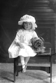 Fraser, Lilly Bank, Fort Augustus. Girl toddler with silky terrier.  