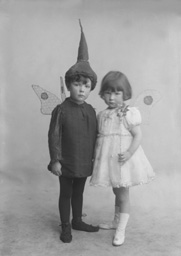 Boy and girl dressed in fancy dress, a pixie and a fairy, named under Mrs  Allan Gilmour, Rhindnie, Lentran.