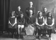 Mr MacConnachie, Farraline Park School. Winners of the Inverness County Primary School Challenge Trophy 1922.        
