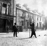 Travelling groups of musicians, showmen and entertainers were a common sight in the streets of Inverness during the 1880s-90s. Performing bears were a regular attraction and always drew a crowd. This bear is standing in Academy Street outside the old Rose Street Foundry building (now a bar) with house numbers 92-94 in the background, c1895. *