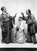 November 1927 production of 'The Geisha,' the story of a Japanese tea-house performed by the Northern Amateur Operatic Society. In the advert it was noted that prices would be increased for this attraction due to the lavish expense of the production (over ?200), in aid of the Queen Victoria Jubilee Institute for Nurses. Duncan Macpherson was the Marquis Imari (on the left). #