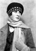 Woman with scarf and tartan bonnet.#