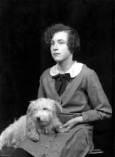 Young woman portrait, with pet terrier dog. #