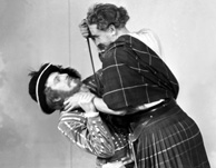 Sorrell vs MacKinnon. Stage actors in costume posing for publicity shots. See also 31334a to 31334c. Man wearing hat is believed to be Henry Christie Landon Sorrell, involved in local amateur dramatics, and manager of the Inverness Repertory Company in 1937 and of the Little Theatre in Inverness, taking over from Ronald Macdonald Douglas in August 1938. (Born 1911 in Endon).