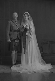 Major & Mrs Fraser, bridal. Major James W. Fraser was born in 1893 at Crask of Aigas, Beauly, and served in the Queen's Own Cameron Highlanders from 1910 to 1939. On 15th February 1943 married Miss Nancy Ford, daughter of Major John Ford DCM, late Cameron Highlanders, and Mrs Ford, Inverness. 