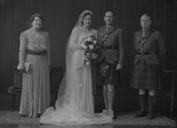 Major & Mrs Fraser, bridal. Major James W. Fraser was born in 1893 at Crask of Aigas, Beauly, and served in the Queen's Own Cameron Highlanders from 1910 to 1939. On 15th February 1943 married Miss Nancy Ford, daughter of Major John Ford DCM, late Cameron Highlanders, and Mrs Ford, Inverness. With Major A.F. MacGillivray, the best man, and Miss M. McLeod. 