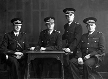 Mrs Johnston, Bridge Street, Inverness. Identification information kindly provided by Dave Conner and Duncan Chisholm.  Officer on the left is Acting Chief Constable Andrew Meldrum, appointed on 7th August 1944 when Chief Constable Stewart was summoned to the fledgling Control Commission for Germany.  Second left is Chief James Douglas Stewart, a Canadian from Winnipeg, who was appointed Chief Constable of Inverness Burgh on 11th January 1943 after previous service in the City of Dundee Police. Stewart was later seconded to the Control Commission for Germany from 1944 until August 1946 as the Deputy Inspector General of the Special Police Corps for Germany, with the rank of Colonel.  The other two officers on the right are Burgh Special Constables with Inspector rank. The officer on the far right is Hugh W Johnstone of 17 Bridge Street, Inverness. He lived at Culduthel Gardens. One of his brothers owned a shoe shop on Grant Street and the other, Daniel, lived next to Chief Constable Paterson at the corner of Ballifeary Road and Glenurquhart Road.