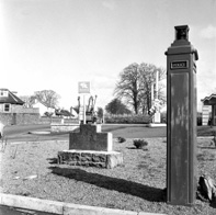 National petrol station, under the name Macbeath, C.A. Academy Street. Location is on Old Perth Road, now the Kingswell Service Station. The stone which now sits behind the petrol station kiosk. It reads: Behind this is the supposed burial place of King Duncan. 1040. To the right is a police phone box. *