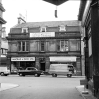 Friends' Provident Century Insurance, Macrae & Dick radio and tv shop and Mitchell & Craig (purveyors of fine foods and rare wines) in Academy Street, Inverness. Entrance to the Andrew Paterson Studio was to the left of Macre & Dick. *