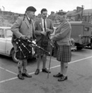 Matheson (on right) talking with pipers in the car park of what is now Farraline Park Bus Station, Inverness.