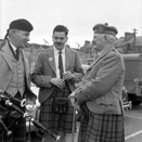 Matheson (on right) talking with pipers in the car park of what is now Farraline Park Bus Station, Inverness.