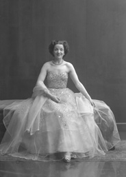 Miss Cairns, Station Hotel, Inverness, in ball gown, seated. Other images also under code 42904.