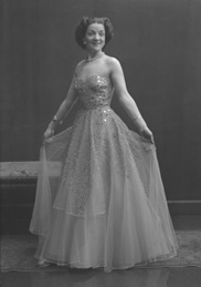 Miss Cairns, Station Hotel, Inverness, in ball gown, standing. Other images also under code 42904.