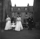 Miller, 'Broomfield,' February 1954. Bridesmaids entering the Old High Church on Church Street, Inverness. At right is Jean Fraser, sister of the bride. In the background is the entrance to Deacon's Court. 