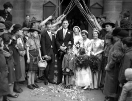 Bridal procession with Scouts and staffs. Possibly taken outside the old West Church in the late 1930s. The leader on the right of the guard of honour is John R. Cowieson, Scoutmaster of the 3rd Inverness (Crown) Troop from 1936. He moved to Fife in the late 40s-early 50s and was District Commissioner and County Commissioner there for a number of years. #