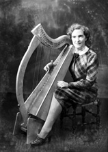 Miss Rhoda MacPherson, Crown Drive, Inverness. She had been awarded first prize at the Gaelic Mod at Dundee on 30th September 1937 for the best performance of Celtic Music on the clarsach. Damaged plate.