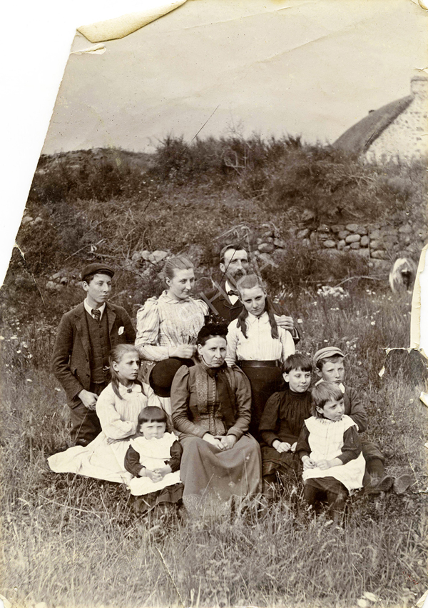 Robert Cook and family. Joseph Cook is the seated boy at the right wearing a hat.   