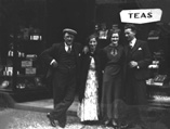 Group outside a tea shop.* 