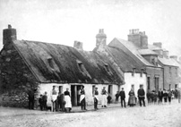 Thatched cottages in Tomnahurich Street, Inverness c.1890s. Water pump on the street corner in front of the house on the left.*  