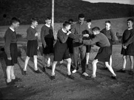 Youths sparring in boxing match. #