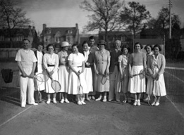 Mixed group on tennis court. #