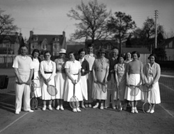 Mixed group on tennis court. #