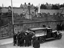 Funeral leaving St. Laurence Parish Church in Forres. The graveyard was used until the mid 19th century, when the Cluny Hill Cemetery was opened. The mainly 18th century gravestones in the church grounds were removed in the 1970s in a 'tidy-up' of the town centre. #  