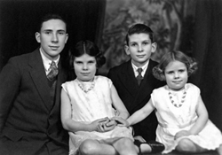 Archie, Sydney, Rita and Gladys Millar in an Andrew Paterson portrait from the early 1930s. Archie was born in Huntly on 14th June 1915. His mother Grace Alexander was from Huntly, where her brothers had a shoe shop. Archie's father, David Millar, had come from Dundee to work in a branch of the Royal Bank of Scotland. Although Archier was born in Huntly he spent most of his school days in Munlochy on the Black Isle. His father had gone there to run a small branch of the Royal Bank of Scotland. Submitted by Archie's son Roddy Millar. (AP/H-0304).