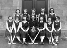 Hockey 1st XI 1946-1947. Team members were: Effie McIntyre (C), Netta Paterson (VC), Peggy MacLeod, Lorna Menzies, Adele Mitchell, Aileen Barr, Belle Munro, Margaret Corbett, Janet Jarrott, Sheila S. Cameron and another. At centre is Miss Maude Yule. (Courtesy Inverness Royal Academy Archive IRAA_020).