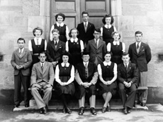 Inverness Royal Academy Prefects 1944-1945. Rear: Sheila Urquhart, Donald Campbell, Wilma MacDonald. Middle: Thomas Forrester, Evelyn Cameron, Allan Cook, Norma MacDougall, William Cattell, Muriel Riggs, Angus MacLeod. Front: Hamish Gray (VC from 03.01.1945), Christina Fraser (VC from 17.04.1945), Rector D.J MacDonald, May Murray, James Nairn (VC to Dec 1944, C from 03.01.1945) (Courtesy Inverness Royal Academy Archive IRAA_042).