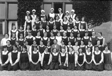 The Inverness Royal Academy War Memorial Hostel, June 1924. The hostel opened in 1922, with accommodation for about 60 girls. In the centre of the second-front row is the first matron, Miss Isabella Paterson. The hostel was partly funded by contributions from the Old Boys' Club, led by Evan Barron, a well-known former pupil. The building first used was the former Inverness Collegiate School building in Ardross Street, which is now the oldest part of the Highland Council Headquarters buildings. The hostel was moved to Hedgefield House in Culduthel Road in 1934. (Courtesy Inverness Royal Academy Archive IRAA_058). 