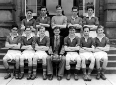 Association Football 1st XI Cup Finalists 1951-1952. Rear: John A. MacKenzie, Archibald MacAulay, James T. Smith, Angus A. MacLean, Will Cameron. Front: Alfred MacKintosh, David Forrest, Lachlan Russell (C), Mr Frank Cunningham, Leslie Hodge (VC), Neil W. Smith, Ian Rodger. (Courtesy Inverness Royal Academy Archive IRAA_077).