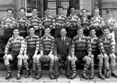Rugby 1st XV 1953-1954. Rear: A. Cunningham, A. Robertson, A. MacLeod, William Ford, I. Finlay, R. Paterson, I. Robin, J. Robertson, K. Frewin. Front: S. Sanderson, A. Griffiths, A. MacDiarmid, D. Robin, D. Dewar, I. Philip. (Courtesy Inverness Royal Academy Archive IRAA_082).