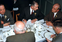 Rotary Club dinner. At left is William Henderson, on the right is Mr Hamilton. (Courtesy James S Nairn Colour Collection) ~
