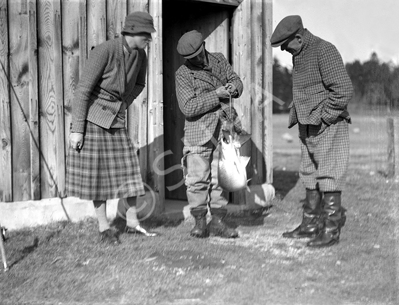 Unidentified celebrity people salmon fishing at Dochgarroch. *