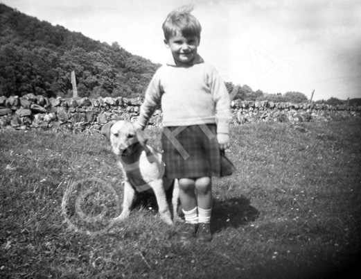 Mrs Tuach, Hillview, Conon Bridge. Copy. Identified in 2014 as himself by Tom McCallum, in Strath Conon, 1946 with the dog Rex. 
