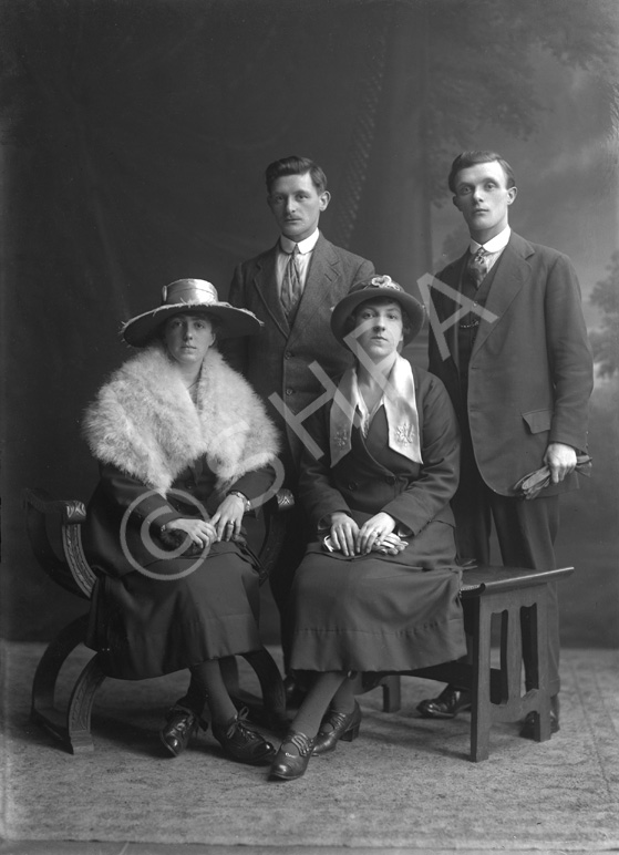 Two couples, portrait, men standing.#