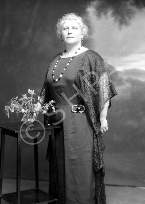 Mrs Peter Paterson, Kiltearn, Inverness. Anne Margaret Mackintosh, born 1870 was a domestic servant when she met and married master baker Peter Paterson in 1897. By 1911 they had adopted a daughter, Dorothy M. Robertson. When her sister died of tuberculosis in 1913 (her brother-in-law had died earlier) she took in their children, James Daniel Mackintosh (1905-1970) and Margaret Elizabeth (Maisie) Mackintosh (1907-1920) see ref: 23126. After his sister died, James Daniel emigrated to the USA in 1923, and Peter, Anne and Dorothy Paterson followed in 1925 with their final destination Michigan, Detroit. Peter Paterson was the brother of famous photographer Andrew Paterson (1877-1948).  
