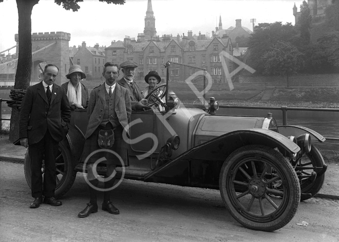 Scottish Home Rule Group outside the Palace Hotel, standing beside vintage car with Ness Bridge in the background. Badge on front of the vehicle, RMC, possibly stands for Renault Motor Company. *