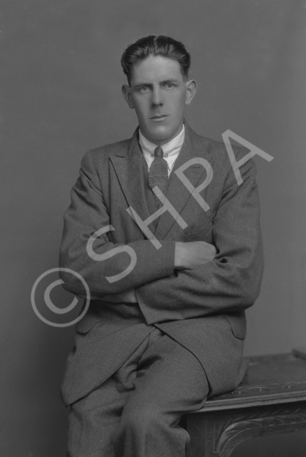 W. MacLean, with arms folded.