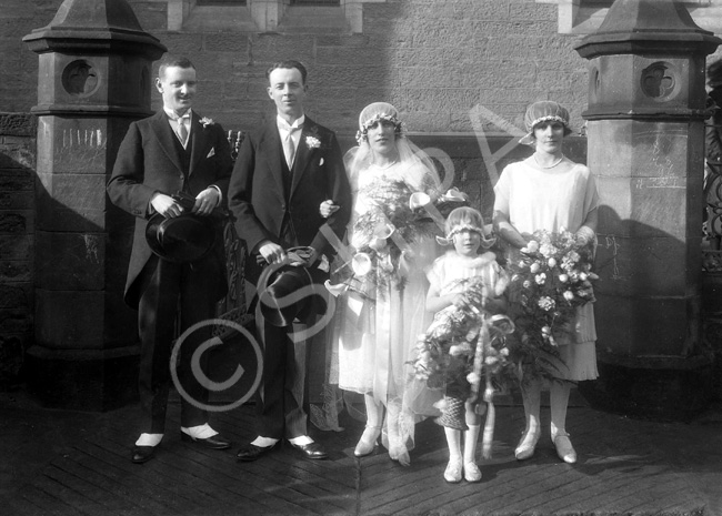 Sinclair - Sutherland bridal group outside Ness Bank Church. The stone plinths still remain after recent renovations to comply with the requirements of the Disability Discrimination Act for access to the Church.