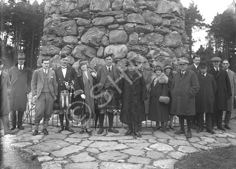 Tourist party at the Memorial Cairn on Culloden battlefield, c.1927.*