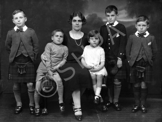 Jessie Macleod (nee Macrae) with Colin, Lorne, Duncan, Dodo and Ishbel. Jessie was a stage actress (see 26822b - the 1927 production of 'The Geisha'). Her husband was Colin Macleod. This family portrait was taken c1925. The boy Colin Macleod served during WWII in the Royal Navy. After being de-mobbed in 1946, he joined the merchant navy, where he rose to the rank of captain. During the early 1960s, he left the service and became Harbour Master at Inverness. He held this position for several years before re-joining the merchant navy. Lorne Macleod became a dentist and had his own practice in Huntly Street until he emigrated to Australia in 1967. Duncan Macleod also became a dentist with a practice in Boness and later Edinburgh. Donald 'Dodo' Macleod remained in Inverness and played football in his younger days for Inverness Thistle Football Club. Information kindly provided by Jessie's grandson Duncan Phillips.