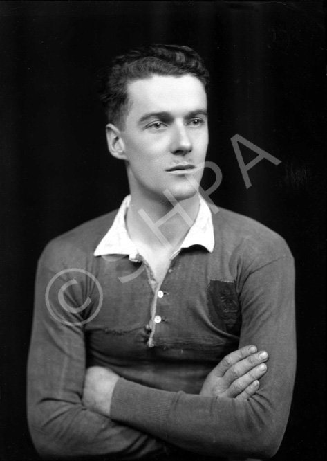 Portrait. The badge on the sports shirt shows a cat and a stag's head. #