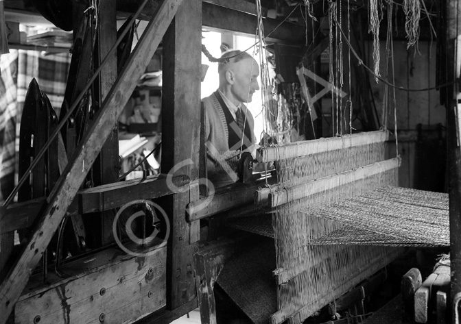 Weaver with loom.*