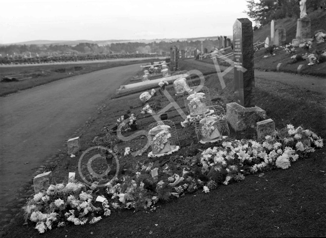 Tomnahurich cemetery. Floral tributes.*