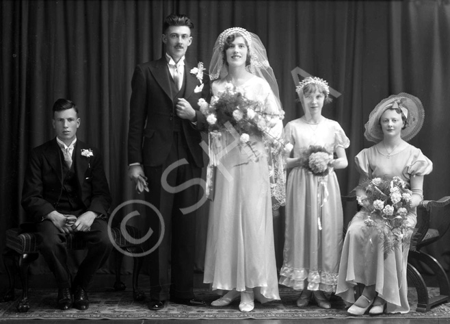 Portrait. The bridesmaid on the far right is also in images 30557a/b under the name MacKinnon. #