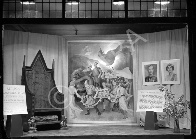 Mr MacAvoy's show window for the May 1937 Coronation of King George VI, complete with a replica of the Coronation Chair and Stone of Destiny from Westminster Abbey.* 