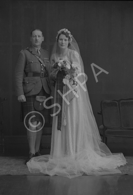 Major & Mrs Fraser, bridal. Major James W. Fraser was born in 1893 at Crask of Aigas, Beauly, and served in the Queen's Own Cameron Highlanders from 1910 to 1939. On 15th February 1943 married Miss Nancy Ford, daughter of Major John Ford DCM, late Cameron Highlanders, and Mrs Ford, Inverness. 